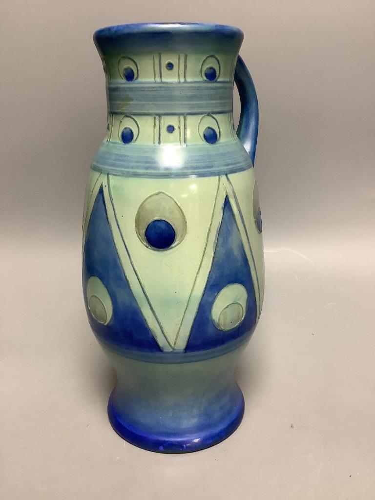 A 1930's Moorcroft blue ‘peacock’ jug, height 27cm